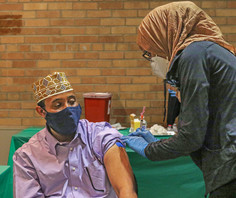Resident getting vaccine