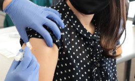 person getting COVID-19 vaccine
