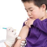 Photo of a boy getting a flu shot