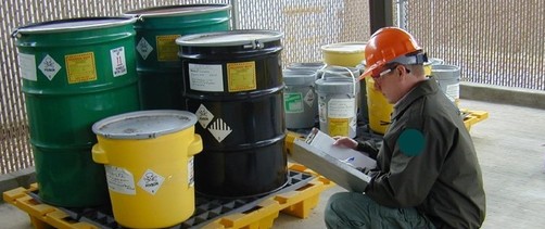 Person inspecting hazardous waste storage area