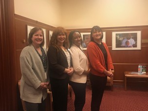 photo of four women in county board office