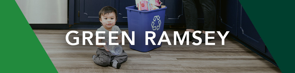 Baby sitting next to recycling bin