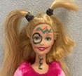 "Weird" Barbie doll with marker on face