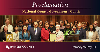 Commissioner McGuire poses with staff for National County Government Month