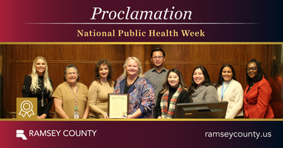 Commissioners pose in photo with Public Health staff for National Public Health Week