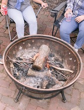 People sitting around a fire pit