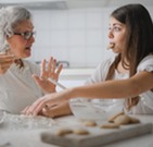 older woman and younger woman cooking