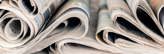 Stack of rolled up newspapers