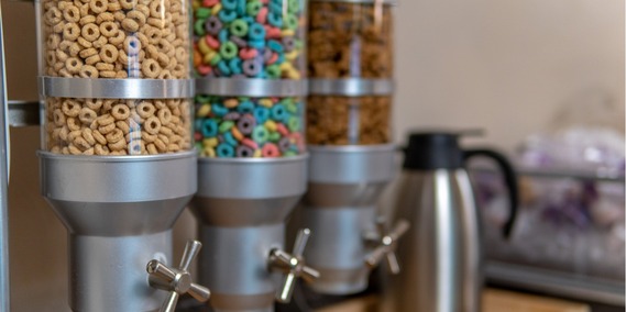 Self-serve dispensers filled with colorful cereal