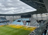 Side view of Allianz Field with part of the soccer field and the empty stadium shown.