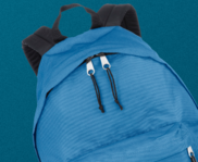 Blue backpack on a blue background