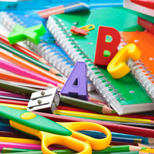 Color pencils, a pair of scissors and ABC magnets