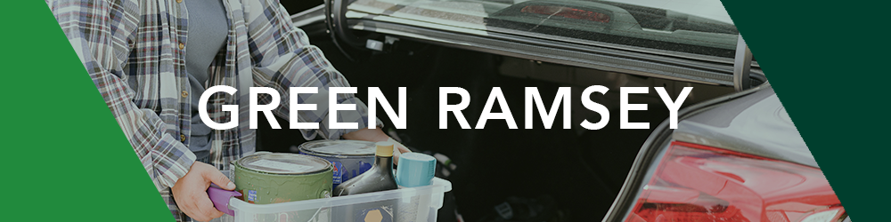 Person carrying bin of household hazardous waste products to car trunk