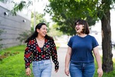 Two woman walking together