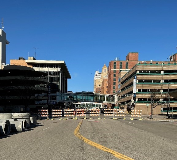 Road closure and storm pipes near the Civic Center.