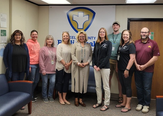 Steele County Public Health staff members with Assistant Commissioner Maria Sarabia in our health department lobby