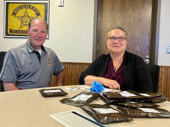 Jason Lukovsky and Jessica Pete with Naloxone kits now available at the St. Louis County Jail