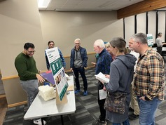 Staff member teaching residents about home electrification
