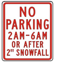 Street sign with text No Parking on City Streets from 2 - 6 a.m. or after a 2 inch snowfall