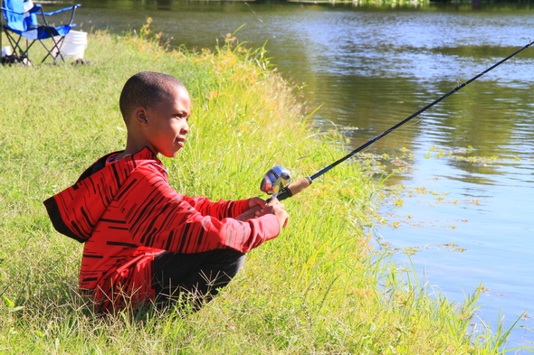 Young boy fishing at Forest Park in St. Louis