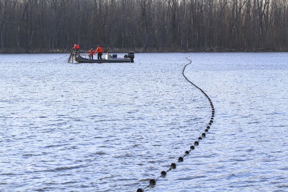 Crews deploy giant block nets to exclude the Asian carp from portions of the lake