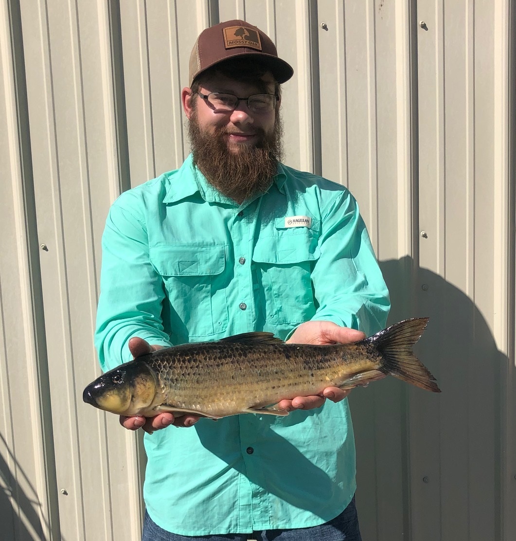 John Garver shows off his state record spotted sucker