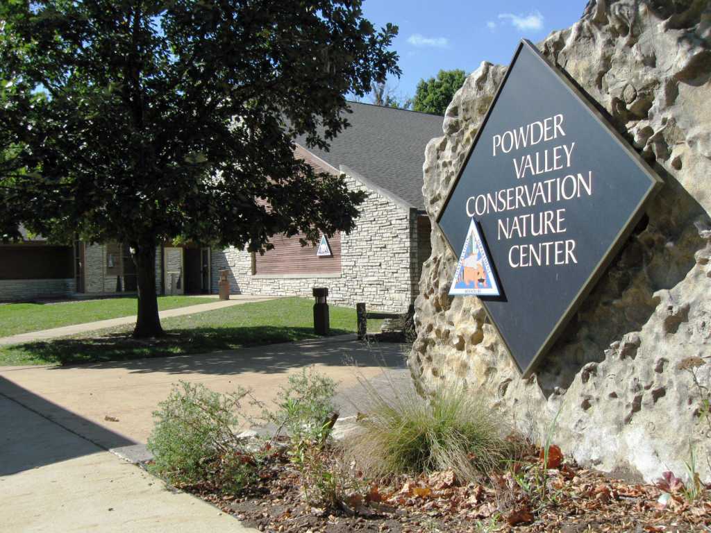 The outside of Powder Valley Nature Center showing the main sign.