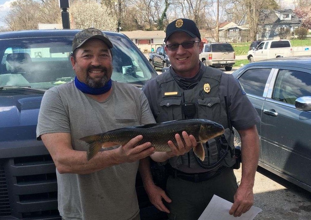 Harvey Smith holds new state record white sucker with MDC Agent Jeff Harris