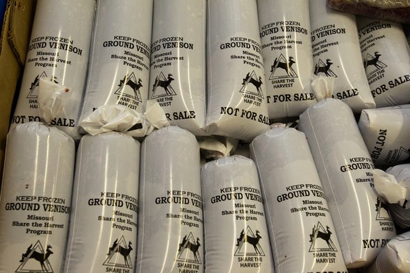 A row of packages showing the Share the Harvest logo with labels indicating frozen ground venison.