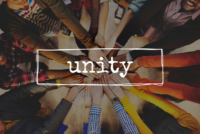 a group of hands coming together in the middle of a circle with the word Unity