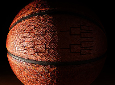 Closeup of a basketball with a tournament bracket