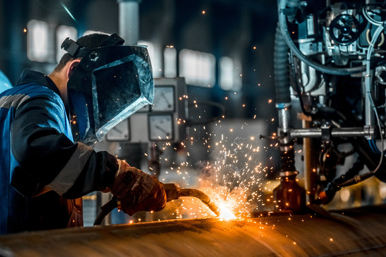 Person Welding with Protective Mask