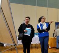 north housing fair participants observe white board with residents' responses 
