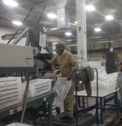 Worker on ladder in warehouse 