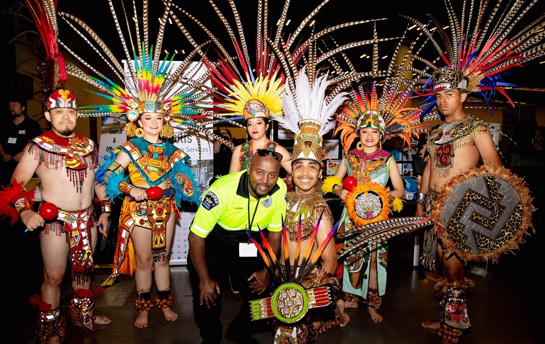 Traffic Control agent and Ballet Folkorico Mexico Azteca dancers at the 2023 Community Connections Conferece