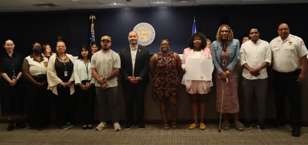 Council Members and staff with Juneteenth honorary resolution.