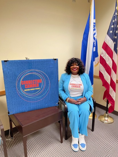 CM Vetaw with a Connecting Camden t-shirt and poster