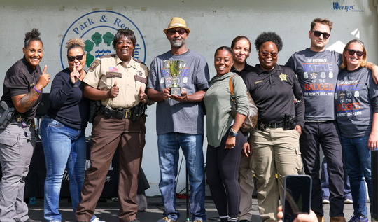 Members of the Hennepin County Sheriff's Office pose as they celebrate their Battle of the Badges win on Sept. 7.