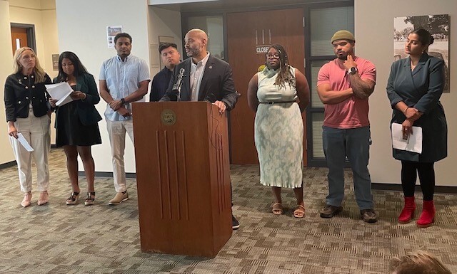 Press conference celebrating the three Housing First policies passed by a supermajority of Council.