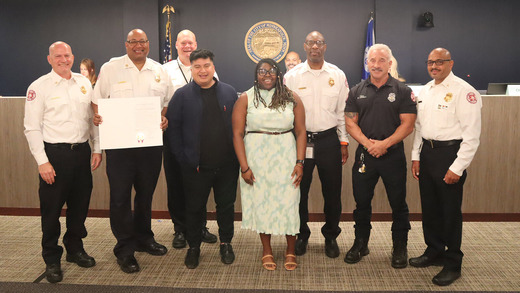 Leadership of the Public Health and Safety Committee with firefighters honoring MFD.