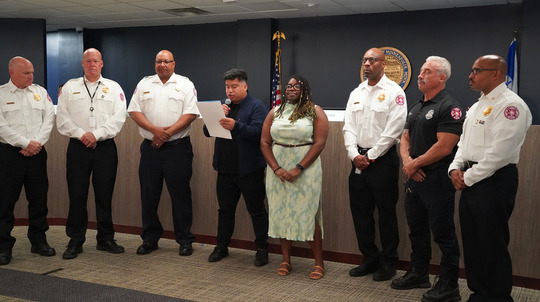 Minneapolis Fire Department leadership with council members Jason Chavez and Robin Wonsley at the Sept. 19 city council meeting