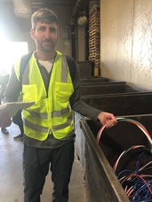 Joe Laurin holds City of Minneapolis copper wire. 