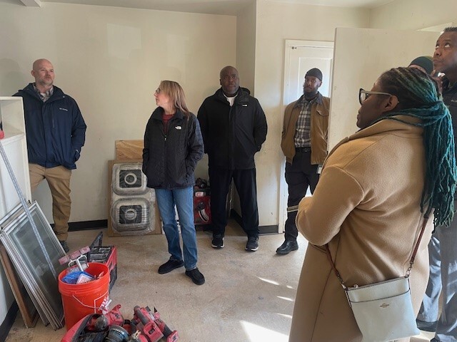 Council Member Wonsley touring a unit being rehabbed at Glendale Townhomes.