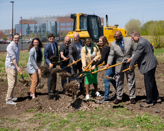 Group photo of shoveling dirt and breaking ground at the new Biochar facility location