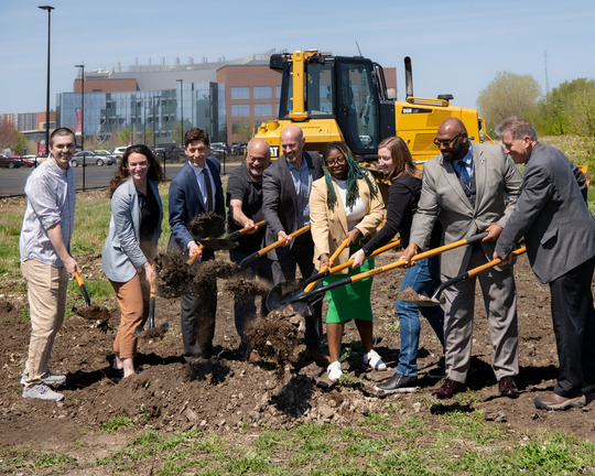Group photo of shoveling dirt and breaking ground at the new Biochar facility location