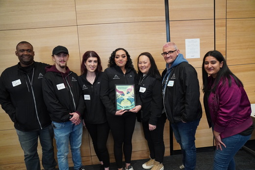 Council Vice President Aisha Chughtai and AVIVO Staff pose together with AVIVO's Health Hero Award.