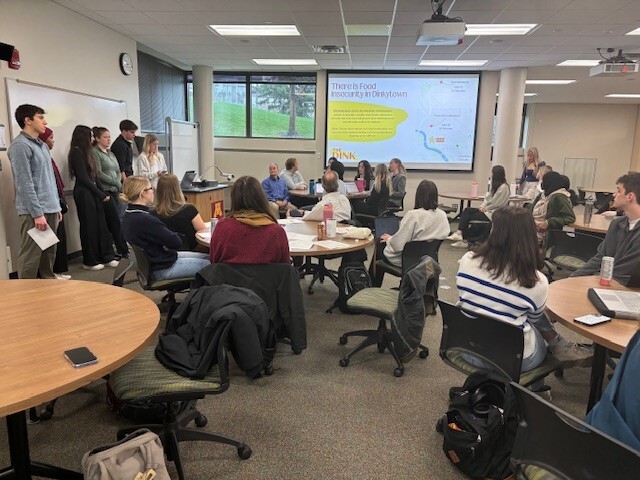 Carlson students present a business plan and feasibility study for "The Dink," a student food co-op. 