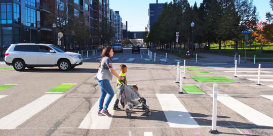 Woman and children crossing the street in Minneapolis