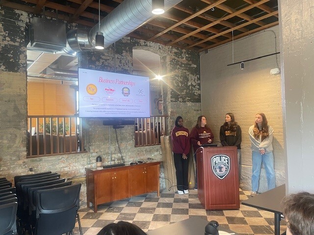 Students from the Carlson School present their Dinkytown branding and placemaking proposal to stakeholders at Bringing U to the Community. 