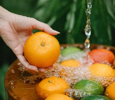 Washing fruits in a bowl
